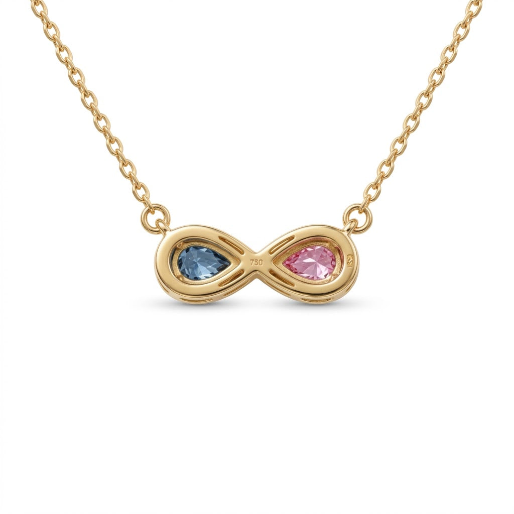 Discover a pink and blue pear-cut infinity pendant with smooth bezel settings. Personalize your gemstone pairing and metal with Gemlux Jewels.