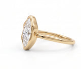 Marquise-cut lab-grown diamond bezel engagement ring with polished yellow-gold band