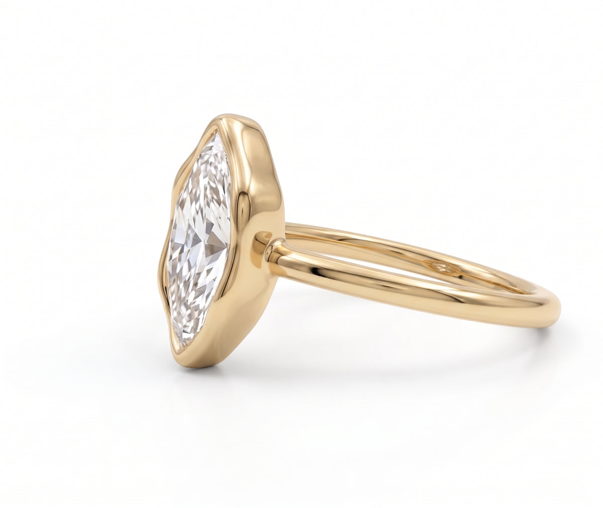 Marquise-cut lab-grown diamond bezel engagement ring with polished yellow-gold band