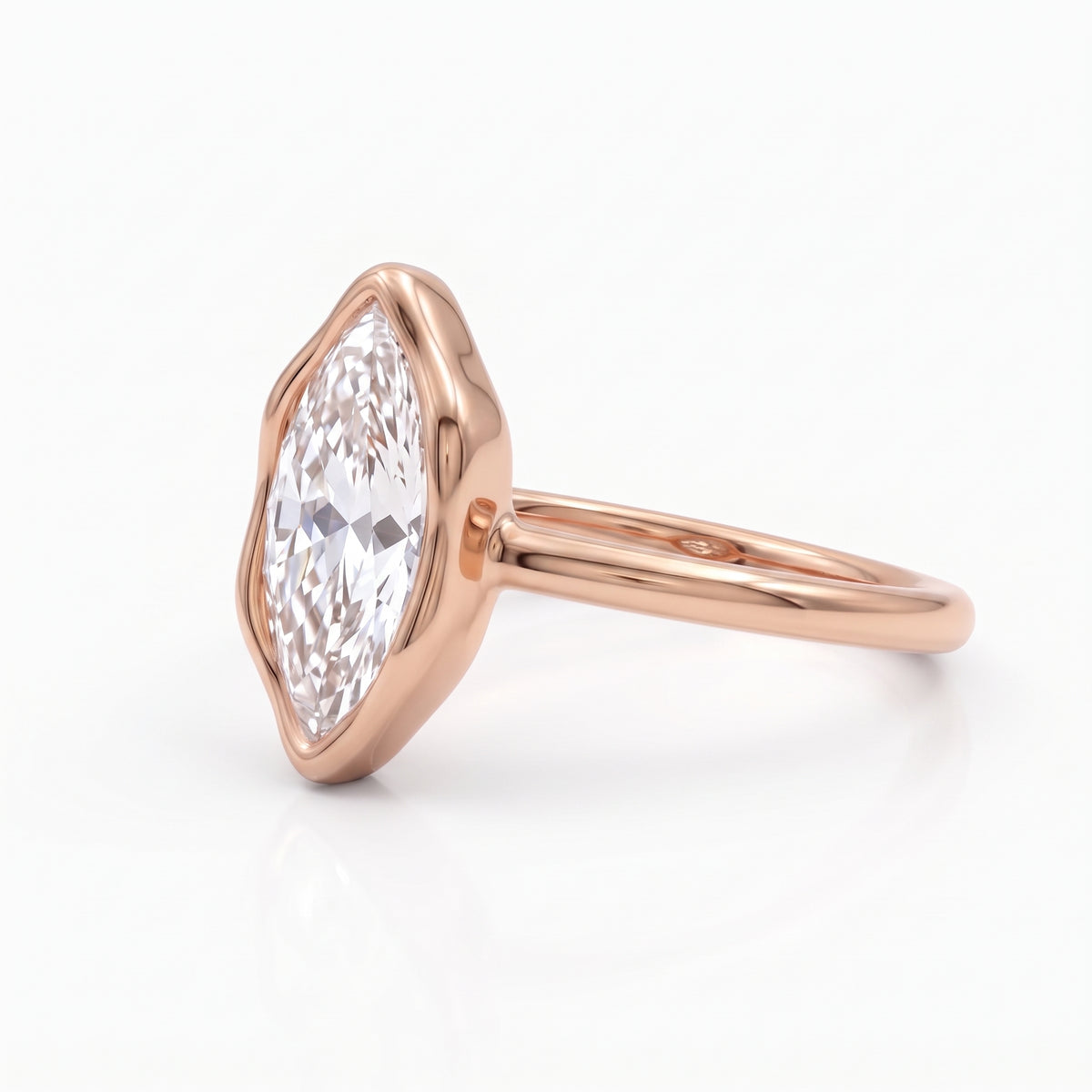 Marquise-cut lab-grown diamond bezel engagement ring with polished yellow-gold band