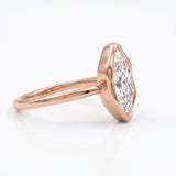 Marquise-cut lab-grown diamond bezel engagement ring with polished yellow-gold band
