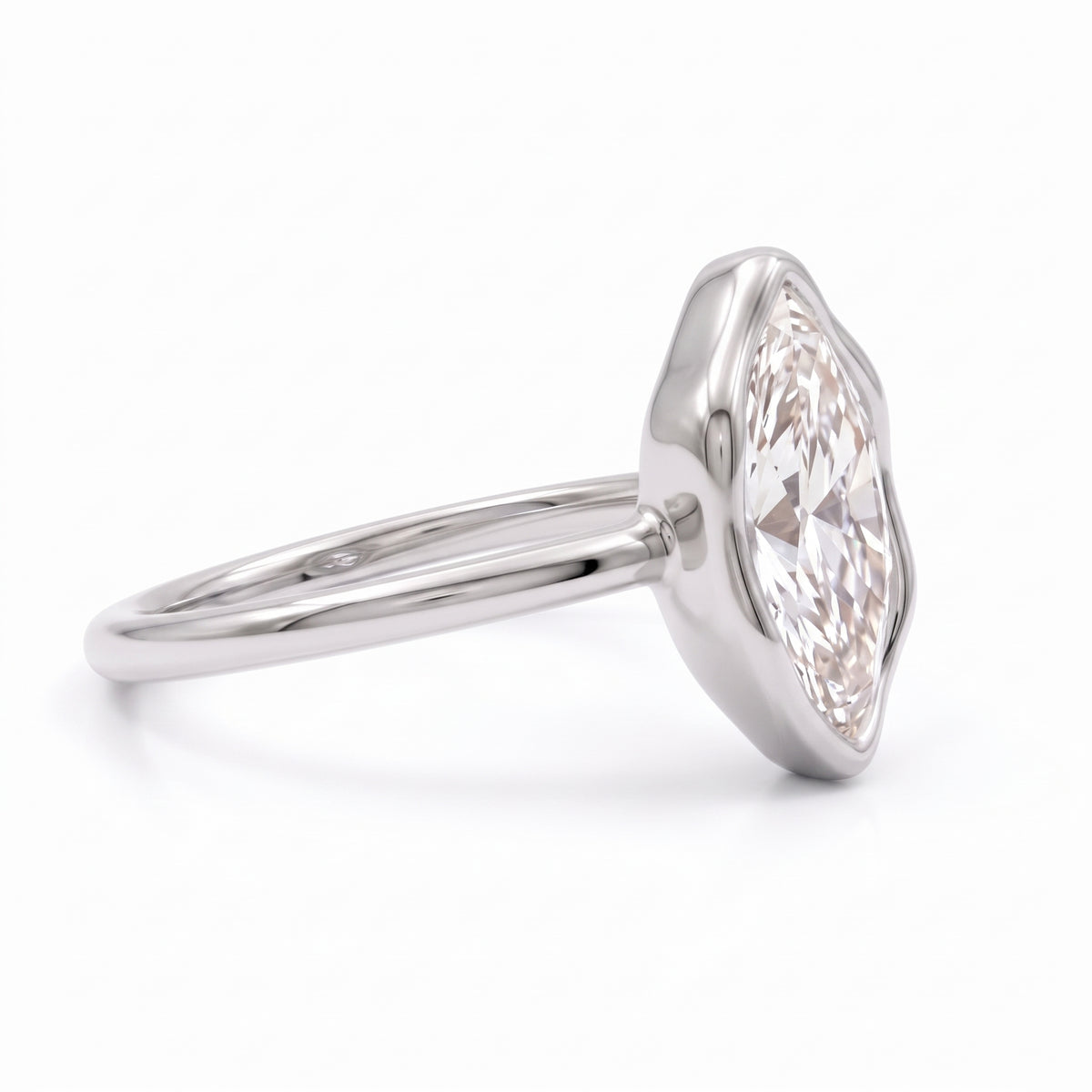 Marquise-cut lab-grown diamond bezel engagement ring with polished yellow-gold band