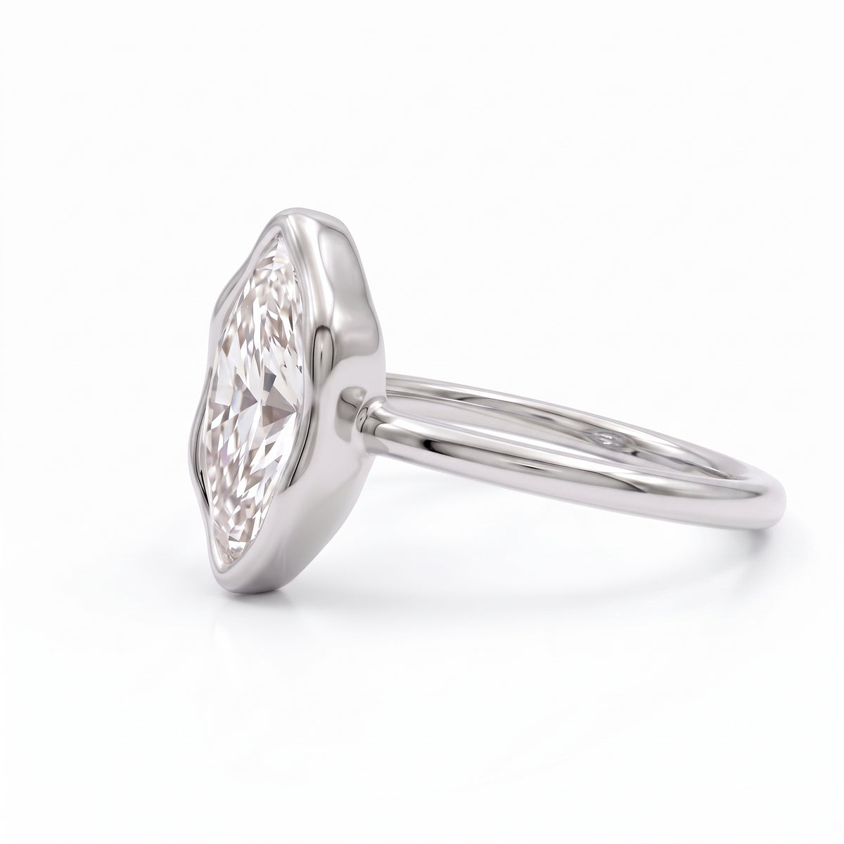 Marquise-cut lab-grown diamond bezel engagement ring with polished yellow-gold band
