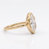 Marquise-cut lab-grown diamond bezel engagement ring with polished yellow-gold band