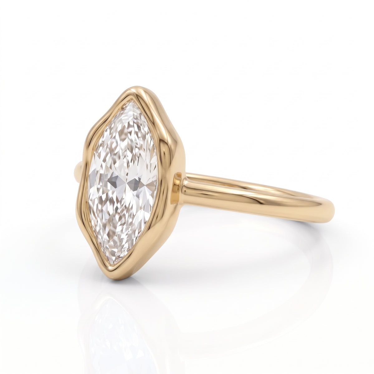 Marquise-cut lab-grown diamond bezel engagement ring with polished yellow-gold band