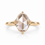 Oval rose-cut lab-grown diamond solitaire engagement ring with a four-prong compass setting and sculpted white-metal band
