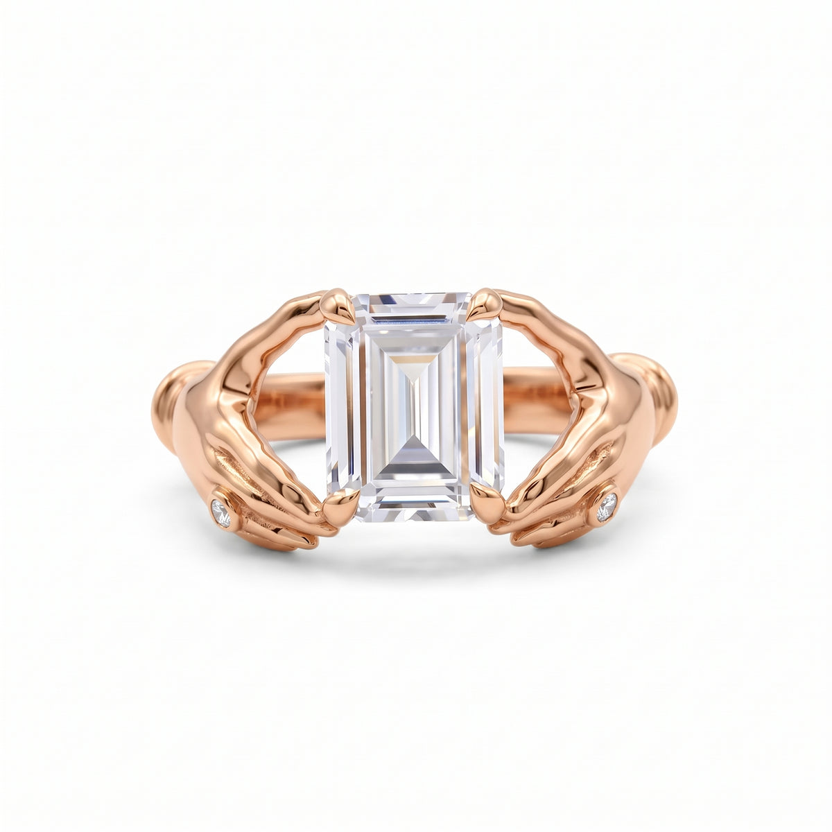Emerald-cut lab-grown diamond engagement ring with a sculpted gold double-dolphin band and round diamond accents