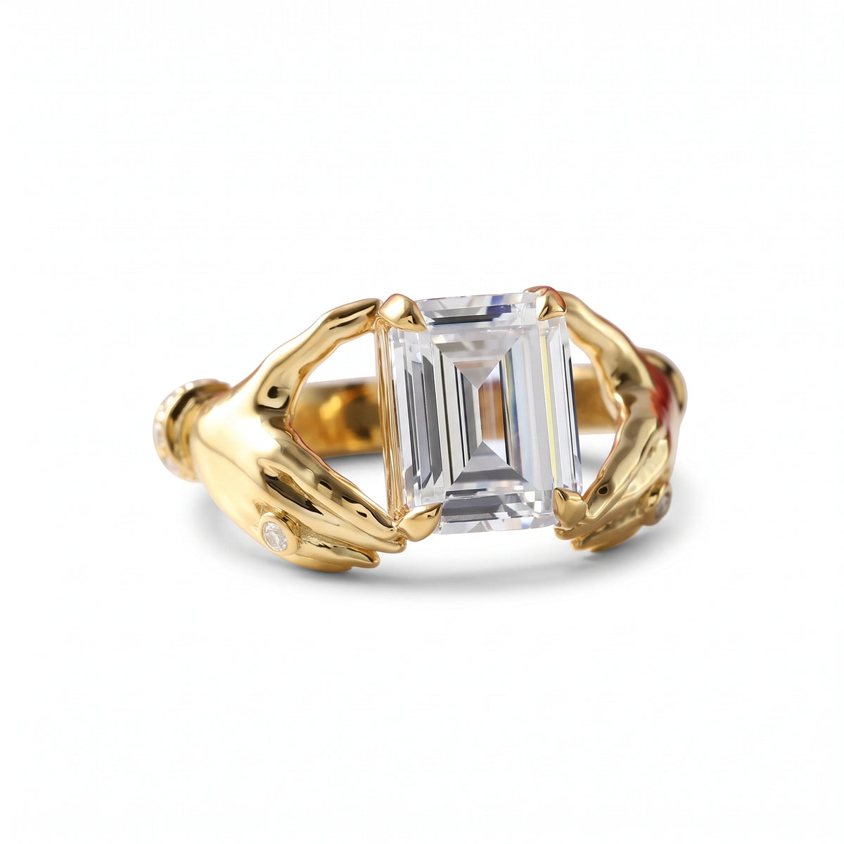 Emerald-cut lab-grown diamond engagement ring with a sculpted gold double-dolphin band and round diamond accents