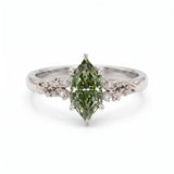 Fancy green marquise-cut lab-grown diamond engagement ring with a vintage gold vine band and round diamond accents