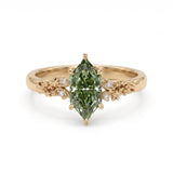 Fancy green marquise-cut lab-grown diamond engagement ring with a vintage gold vine band and round diamond accents