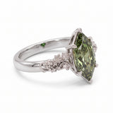 Fancy green marquise-cut lab-grown diamond engagement ring with a vintage gold vine band and round diamond accents