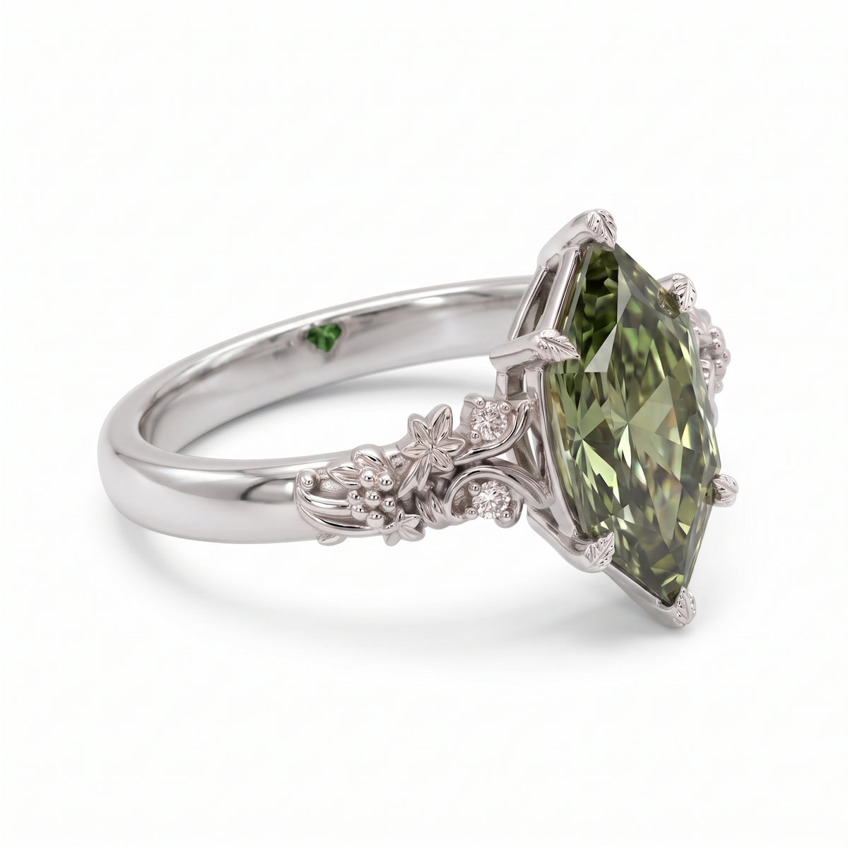 Fancy green marquise-cut lab-grown diamond engagement ring with a vintage gold vine band and round diamond accents