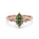 Fancy green marquise-cut lab-grown diamond engagement ring with a vintage gold vine band and round diamond accents