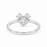 A silver-tone diamond ring with a heart-shaped diamond cluster and a pavé-set band, shown on a plain white background.
