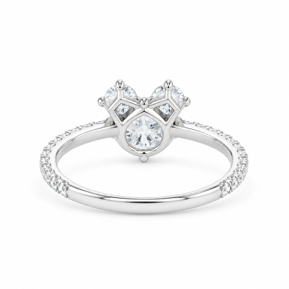 A silver-tone diamond ring with a heart-shaped diamond cluster and a pavé-set band, shown on a plain white background.