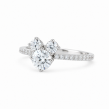 A silver-tone diamond ring featuring a large pear-cut center stone with three smaller heart-shaped stones above it, accented by pavé diamonds along the band, set against a clean white background.