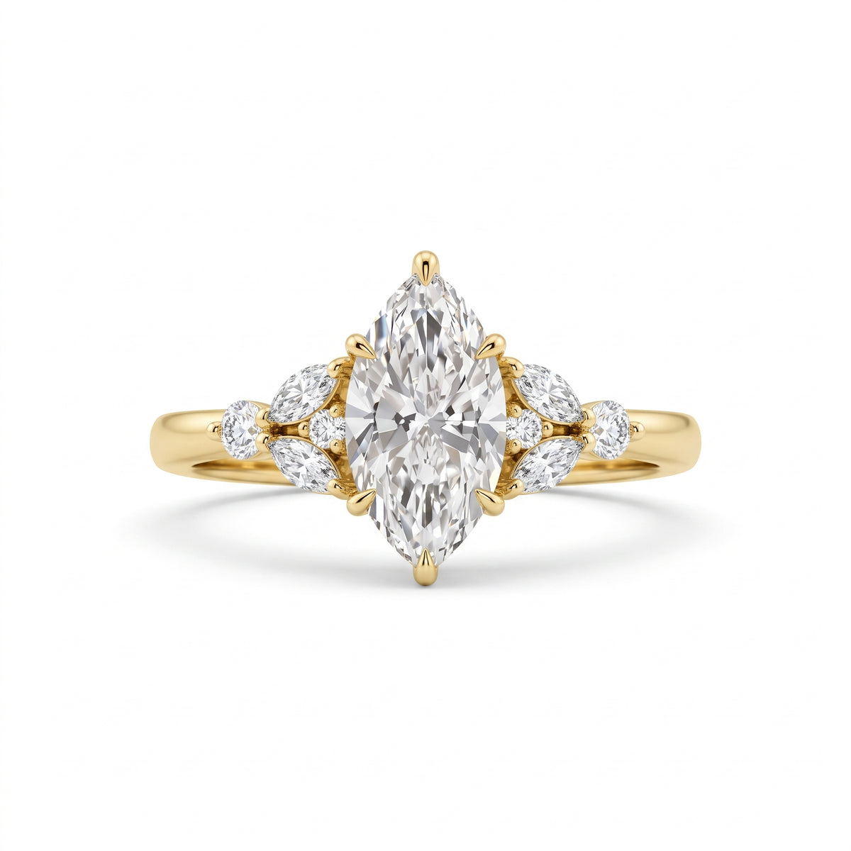 A yellow gold ring featuring a large marquise-cut center diamond flanked by smaller round and marquise diamonds on the shoulders, set against a clean white background.