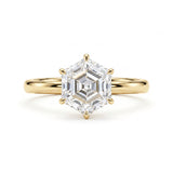 Hexagon step-cut lab-grown diamond solitaire engagement ring with a six-prong setting and polished yellow-gold band.