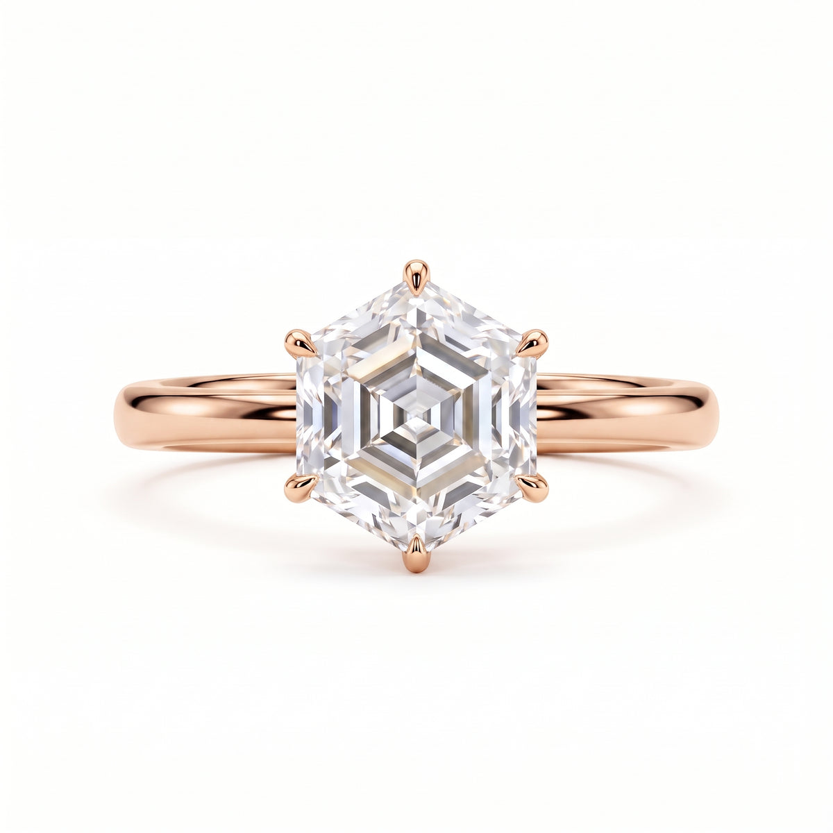 Hexagon step-cut lab-grown diamond solitaire engagement ring with a six-prong setting and polished yellow-gold band.