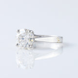 Pinch Style Round Moissanite Solitaire Engagement Ring