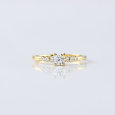 0.5 Carat Round Moissanite Solitaire Ring With Side Stones