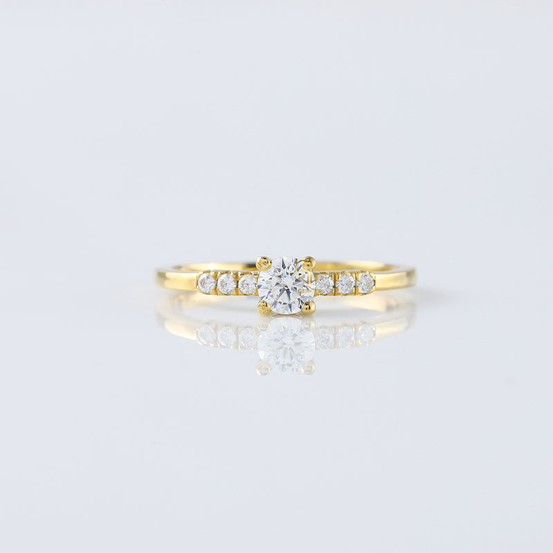 0.5 Carat Round Moissanite Solitaire Ring With Side Stones