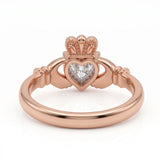 Heart-cut moissanite Irish Claddagh engagement ring with sculpted hands and crown in yellow gold