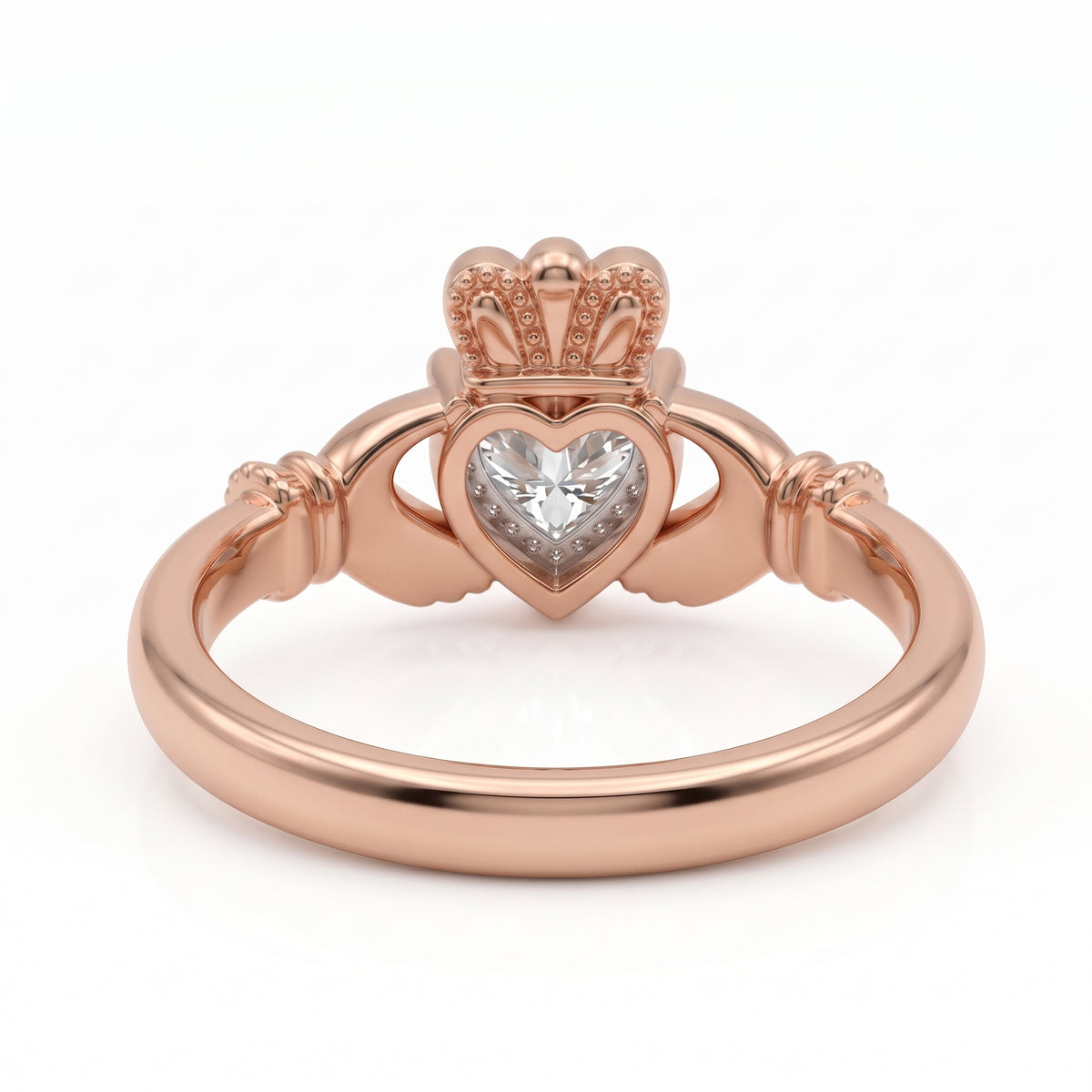 Heart-cut moissanite Irish Claddagh engagement ring with sculpted hands and crown in yellow gold