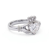 Heart-cut moissanite Irish Claddagh engagement ring with sculpted hands and crown in yellow gold