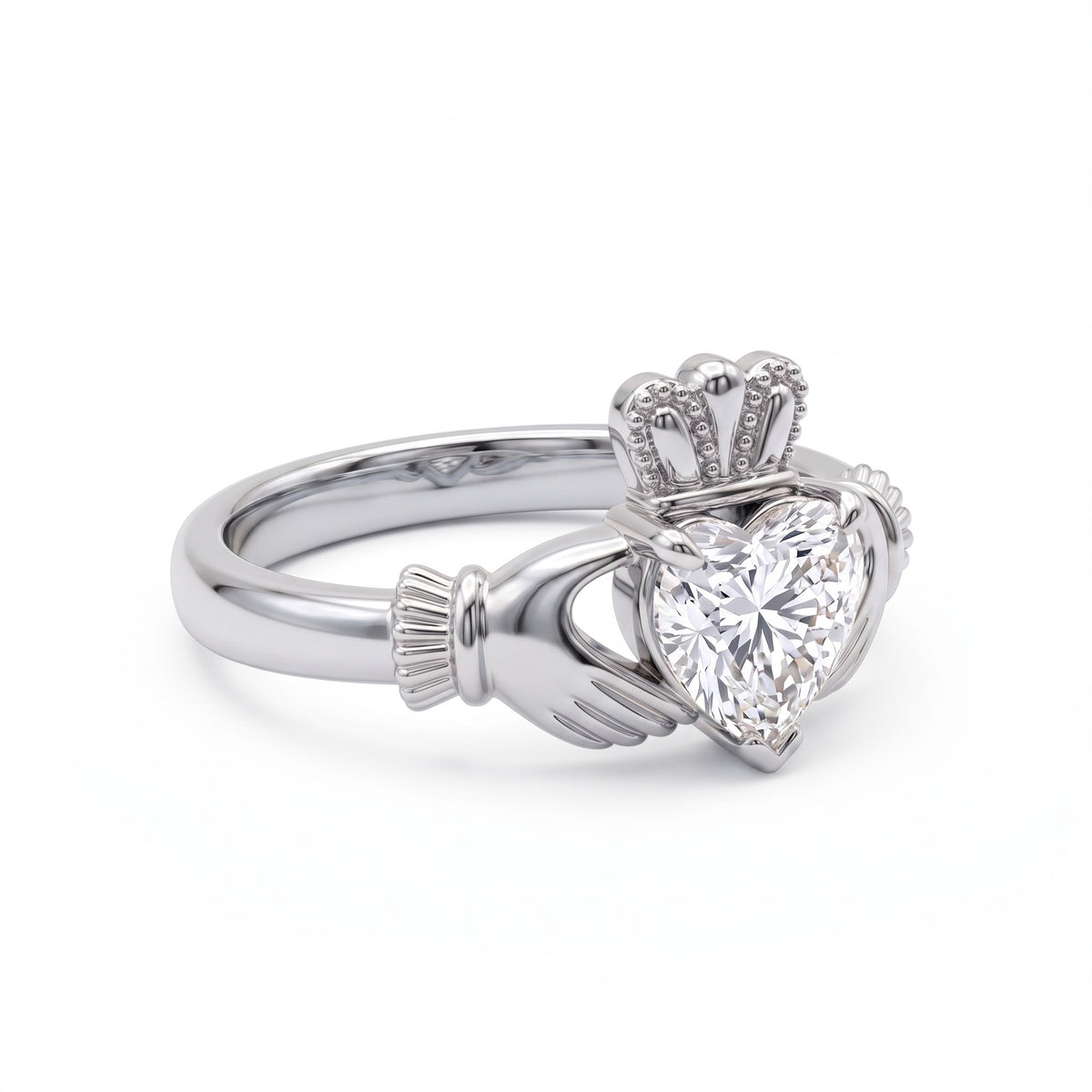 Heart-cut moissanite Irish Claddagh engagement ring with sculpted hands and crown in yellow gold