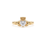 Heart-cut moissanite Irish Claddagh engagement ring with sculpted hands and crown in yellow gold