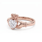 Heart-cut moissanite Irish Claddagh engagement ring with sculpted hands and crown in yellow gold
