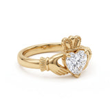 Heart-cut moissanite Irish Claddagh engagement ring with sculpted hands and crown in yellow gold