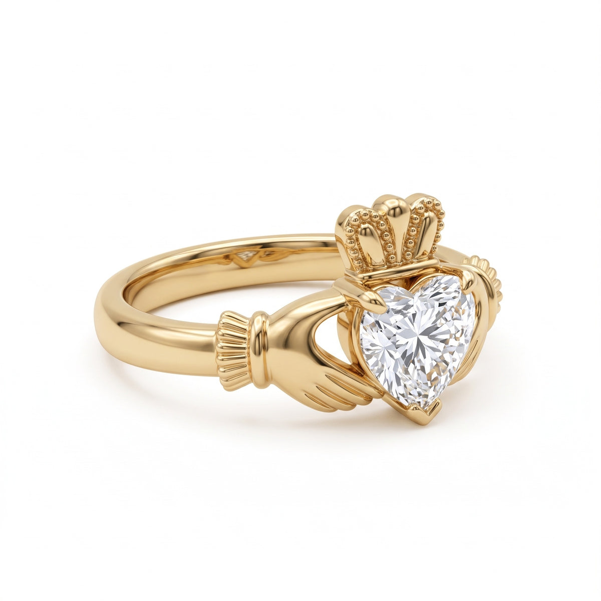 Heart-cut moissanite Irish Claddagh engagement ring with sculpted hands and crown in yellow gold