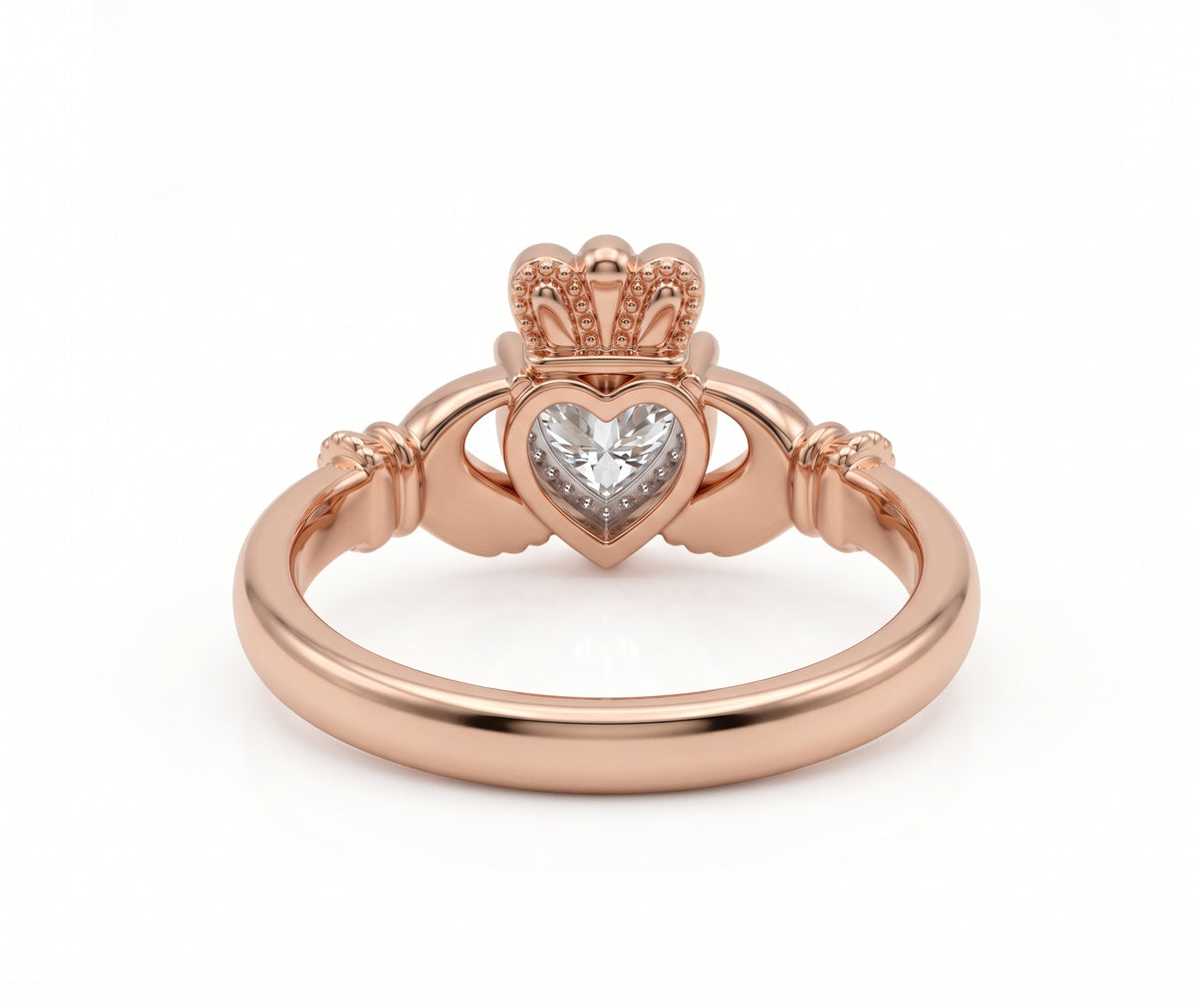 Heart-cut moissanite Irish Claddagh engagement ring with sculpted hands and crown in yellow gold