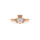 Heart-cut moissanite Irish Claddagh engagement ring with sculpted hands and crown in yellow gold