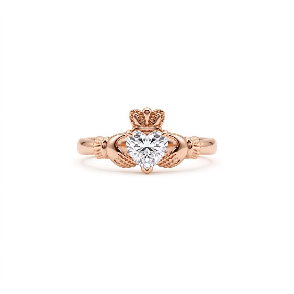 Heart-cut moissanite Irish Claddagh engagement ring with sculpted hands and crown in yellow gold