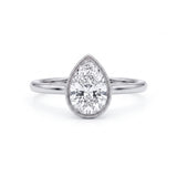 Pear-cut lab-grown diamond bezel solitaire engagement ring with fine milgrain detailing and a polished yellow-gold band.