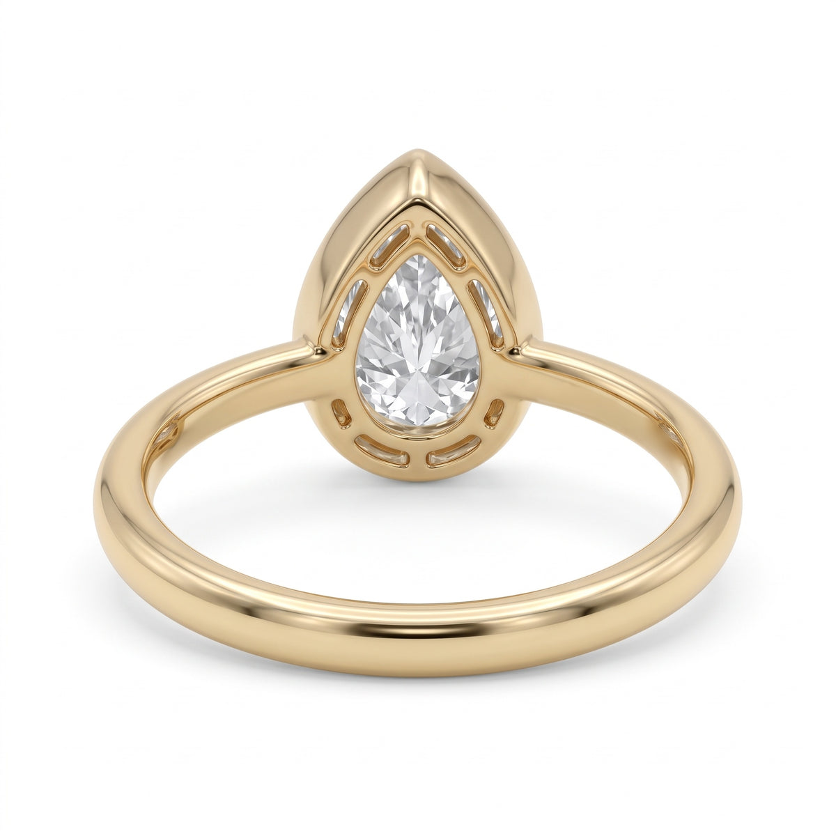 Pear-cut lab-grown diamond bezel solitaire engagement ring with fine milgrain detailing and a polished yellow-gold band.