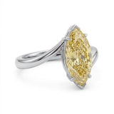Markey ring with fancy yellow marquise lab grown diamond and bypass yellow gold band