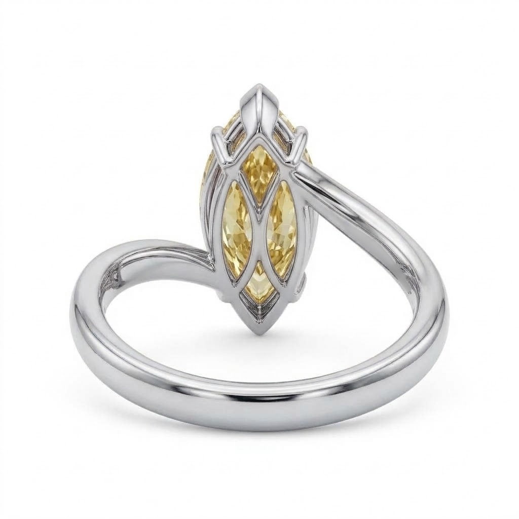 Markey ring with fancy yellow marquise lab grown diamond and bypass yellow gold band
