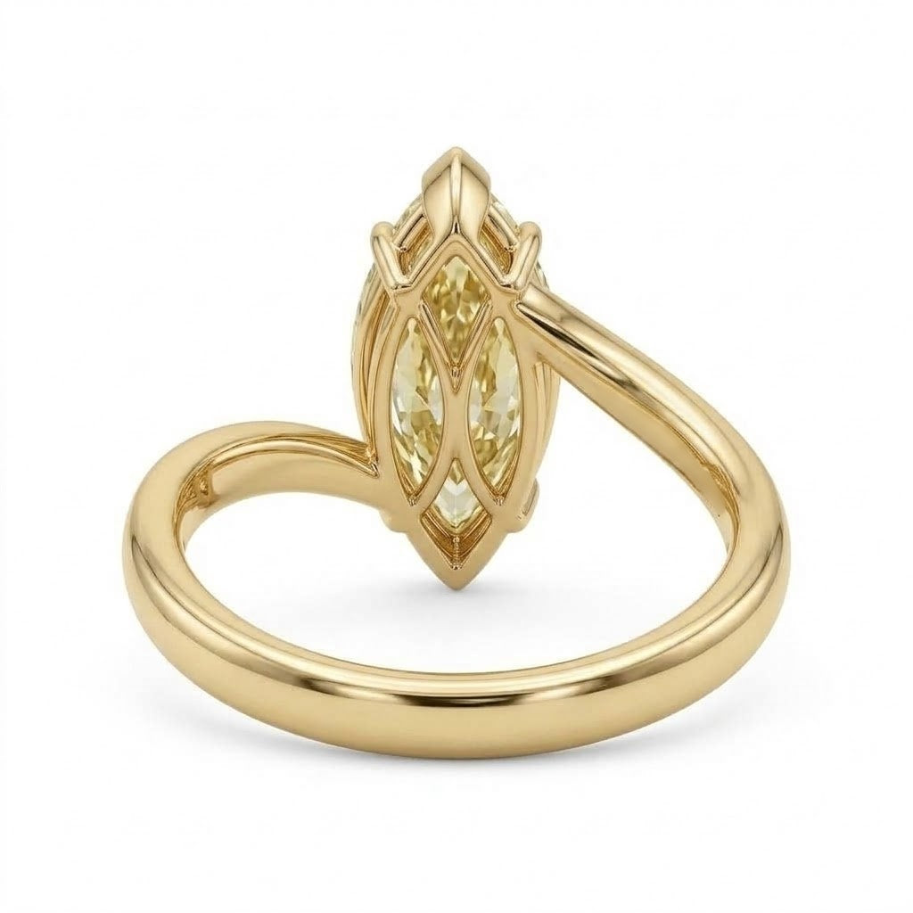Markey ring with fancy yellow marquise lab grown diamond and bypass yellow gold band