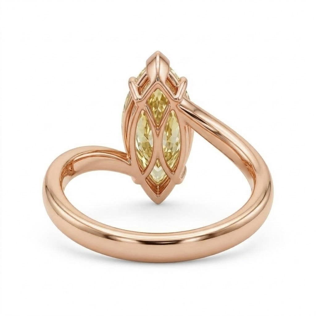 Markey ring with fancy yellow marquise lab grown diamond and bypass yellow gold band
