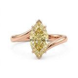 Markey ring with fancy yellow marquise lab grown diamond and bypass yellow gold band