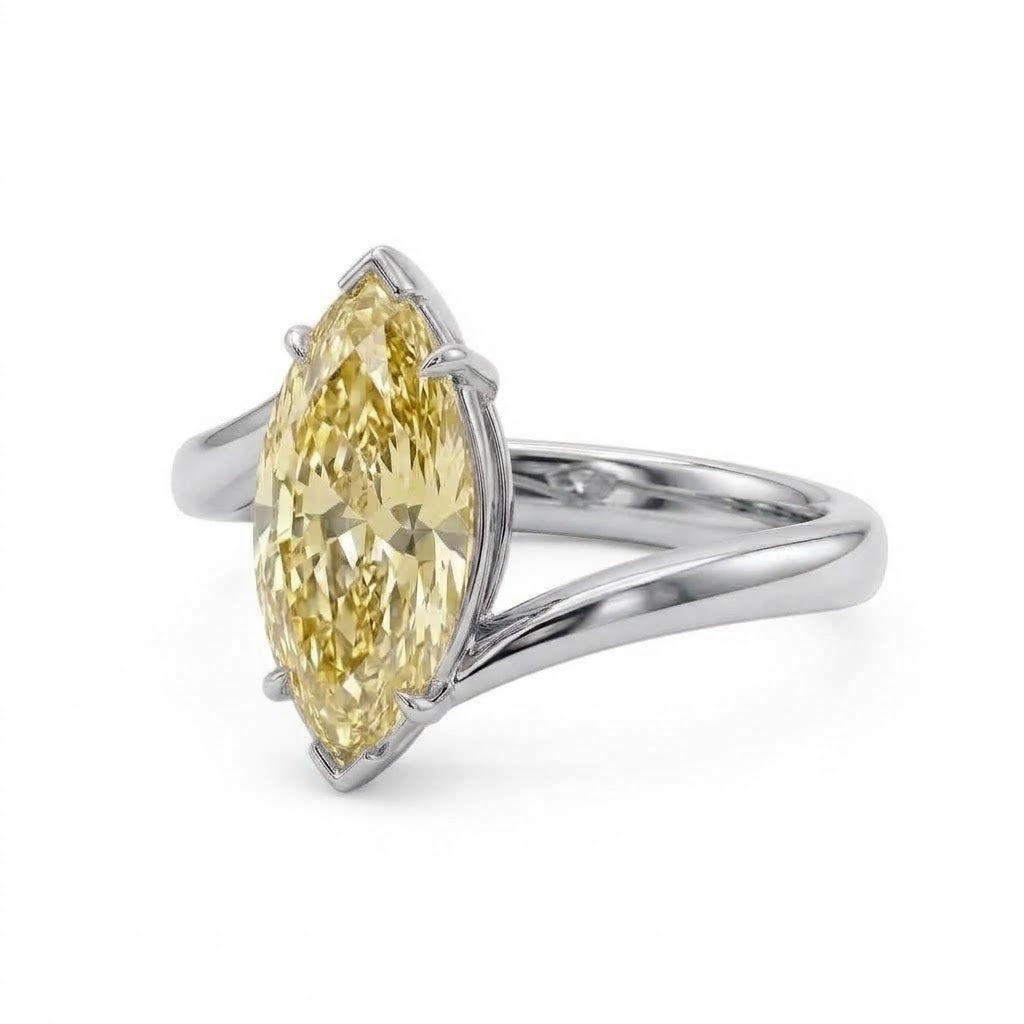 Markey ring with fancy yellow marquise lab grown diamond and bypass yellow gold band