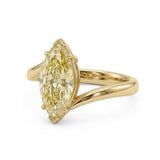 Markey ring with fancy yellow marquise lab grown diamond and bypass yellow gold band