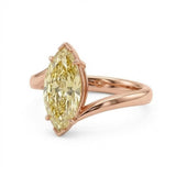 Markey ring with fancy yellow marquise lab grown diamond and bypass yellow gold band