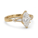 Marquise-cut lab-grown diamond engagement ring with tapered baguette side stones, round accents and a milgrain split-shank yellow-gold band.