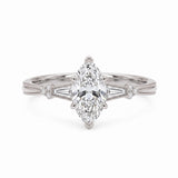 Marquise-cut lab-grown diamond engagement ring with tapered baguette side stones, round accents and a milgrain split-shank yellow-gold band.