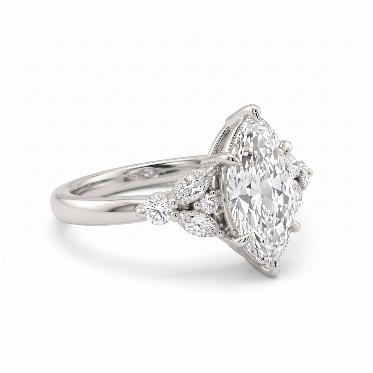 Marquise lab grown diamond engagement ring with marquise and round diamond cluster side stones